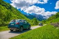 Tourists in Suzuki Vitara car went on a trip to the snow-capped mountains.