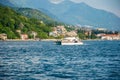 Tourists swim in the Boka Kotorska Bay on a motor catamaran.