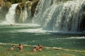 Tourists swim at Krka waterfalls, Croatia