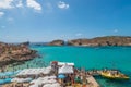 Tourists swimming at Blue Lagoon, Comino, Malta