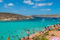 Tourists swimming at Blue Lagoon, Comino, Malta