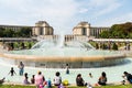 Tourists swimming at the fountain in front of the Palais de Chaillot, a building at the top of the Chaillot hill in the Trocadero