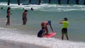 Tourists swimming at the beach