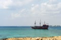 Tourists are swimming in the sea near the pirate ship Black Pearl , Cavo Greco, Cyprus Royalty Free Stock Photo