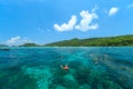 Tourists swimming and snorkeling in Andaman sea at Phi Phi islands one of the most beautifull island in Thailand Royalty Free Stock Photo