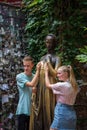 Verona, Italy - August 6, 2019: Tourists take photo with bronze statue of Guilietta, from romeo and juiliet Royalty Free Stock Photo