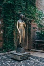 Verona, Italy - August 6, 2019: Tourists take photo with bronze statue of Guilietta, from romeo and juiliet Royalty Free Stock Photo