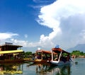 Tourists take a ride on a Shikara at Dal Lake in Kashmir India Royalty Free Stock Photo