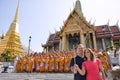 Tourists take a selfie with group of monks