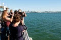 Tourists Take Smart Phone Photos On Ferry In San Francisco Royalty Free Stock Photo