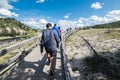 Tourists take a walk on geysers in Yellowstone National Park.