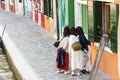 Tourists taken photo in the old Colorful city Burano - Italy