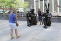 Tourists taken picture in front of Paparazzi Dogman and Paparazzi Rabbitgirl sculpture by contemporary artists Gillie and Marc