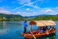 Tourists taking boat on Lake Bled in Slovenia