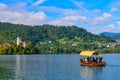 Tourists taking boat on Lake Bled in Slovenia