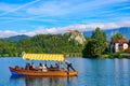 Tourists taking boat on Lake Bled in Slovenia