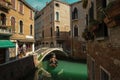 Tourists taking gondola ride in Venice city