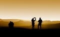 Tourists taking photo at sunset