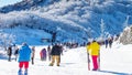 Tourists taking photos of the beautiful scenery and skiing. Royalty Free Stock Photo