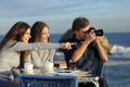 Tourists taking photos from a coffee shop