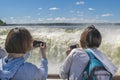 Tourists Taking Photos of Devil Throat at Iguazu Park Royalty Free Stock Photo