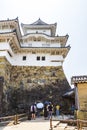 Tourists taking photos of an inner gate from Himeji castle