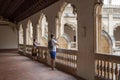 Tourists taking photos inside Monastery of San Juan de los Reyes in Toledo