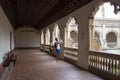 Tourists taking photos inside Monastery of San Juan de los Reyes in Toledo