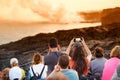 Tourists taking photos at Kalapana lava viewing area. Lava pouring into the ocean creating a huge poisonous plume of smoke at Hawa Royalty Free Stock Photo