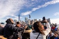 Tourists taking photos of Manhattan on a ferry from Manhattan to the Statue of Liberty Royalty Free Stock Photo