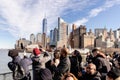 Tourists taking photos of Manhattan on a ferry from Manhattan to the Statue of Liberty Royalty Free Stock Photo