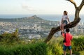 Tourists taking photos of Waikiki and Honolulu from Tantalus Overlook on Oahu Royalty Free Stock Photo