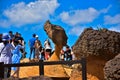 Tourists taking picture at QueenÃ¢â¬â¢s head rock, a main attraction at Yehliu Geopark