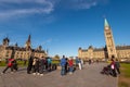 Tourists taking pictures in front of Canadian Parliament in Ottawa Royalty Free Stock Photo