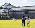 Tourists taking pictures of historic Kanazawa castle Royalty Free Stock Photo