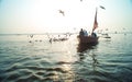 Tourists taking the popular boat tour on the sacred Ganges river in Varanasi, Utta