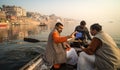 tourists taking selfie camera on the popular boat tour on the sacred Ganges river in Varanasi