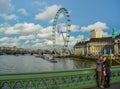 Tourists taking selfie in front of River Thames