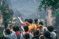 Tourists taking selfies in Zhangjiajie Tianzi lookout