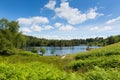 Tourists at Tarn Hows Lake District National Park England uk