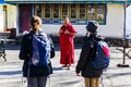 Tourists with Tibetan monk in Tibetan Buddhism Temple with monks in Sikkim, India Royalty Free Stock Photo