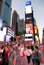 Tourists in Times Square at evening hours.