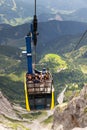 Tourists on top of gondola in the upper station of the Dachstein cable car on August 17, 2017 in Ramsau am Dachstein, Austria. Royalty Free Stock Photo