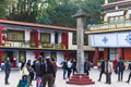 Tourists toss many coin to the top of stone pillar for lucky in the center of Rumtek Monastery in winter near Gangtok. Sikkim