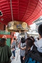 Tourists are touching the Red lanthern in Sensoji Shrine.