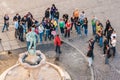 Tourists with the tourist guide gathered in front of the Statue of The Naked Fencer, Wroclaw Royalty Free Stock Photo