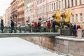 Tourists and townspeople at Griffon sculpture of Bank bridge