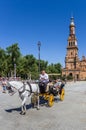 Tourists in a traditional horse carriage at the Plaza Espana in Sevilla Royalty Free Stock Photo