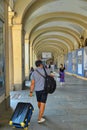 Tourists trasporting trolleys downtown in san carlo square arcades Turin Italy