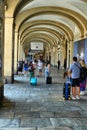 Tourists trasporting trolleys downtown in san carlo square arcades Turin Italy